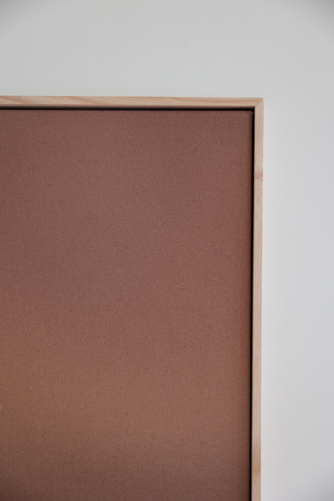 Modern abstract artwork featuring a warm metallic copper gradient with earthy tones and a handmade wood frame