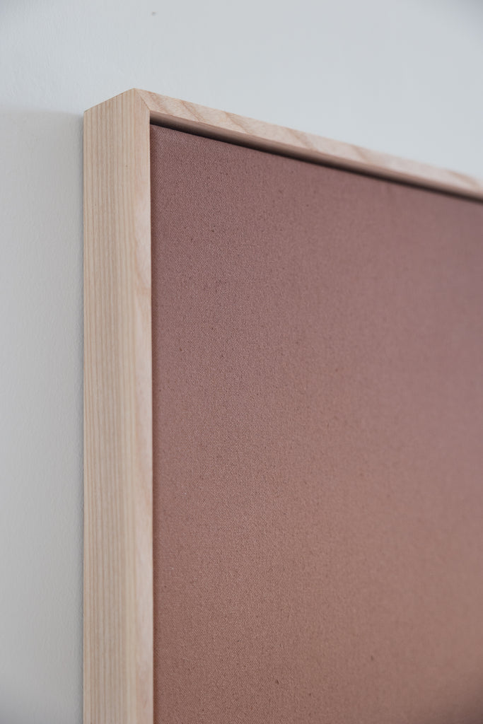 Modern abstract artwork featuring a warm metallic copper gradient with earthy tones and a handmade wood frame