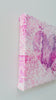 Heart shaped artwork with a white, pink, and magenta gradient
