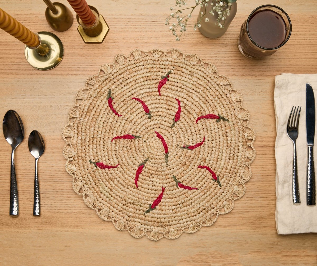 Scattered Chili Handwoven Raffia Round Placemat – Artisan Table Décor - Liza Pruitt