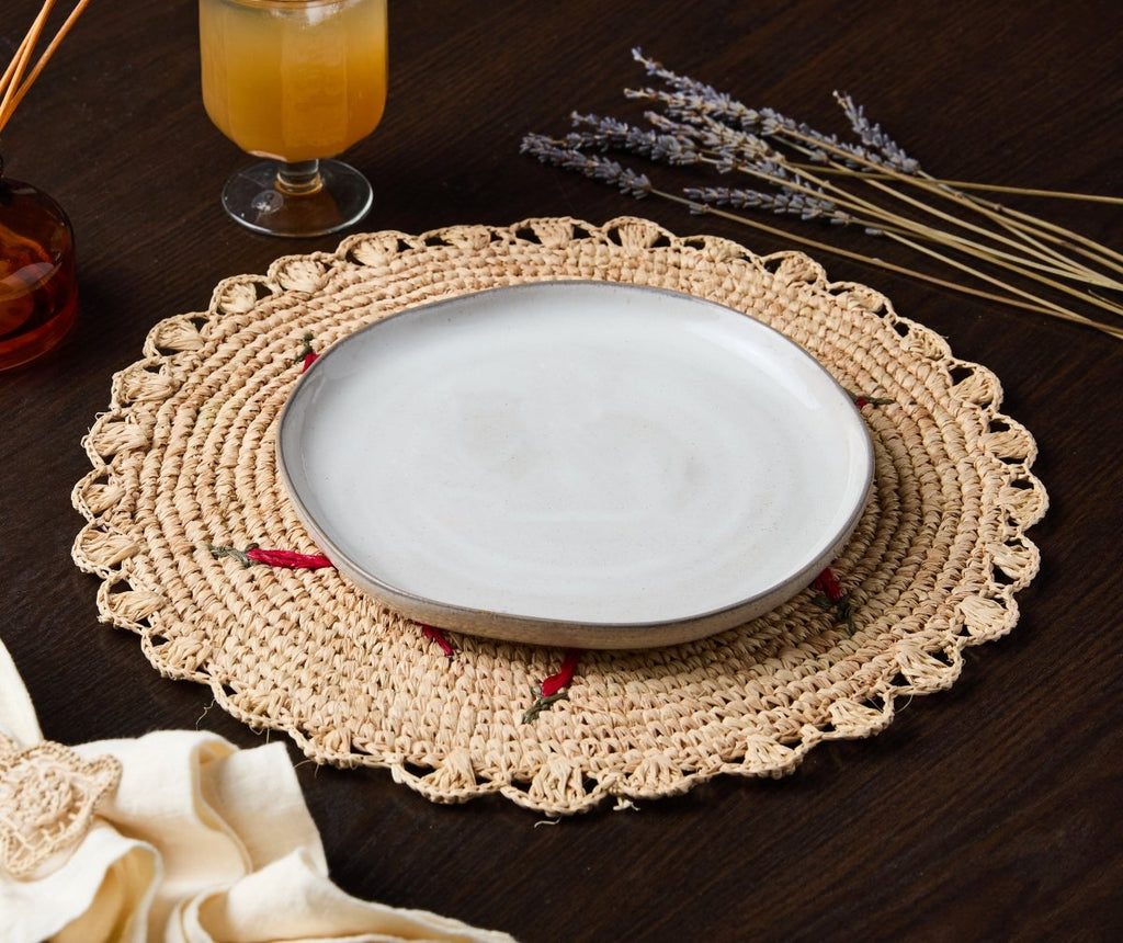 Scattered Chili Handwoven Raffia Round Placemat – Artisan Table Décor - Liza Pruitt