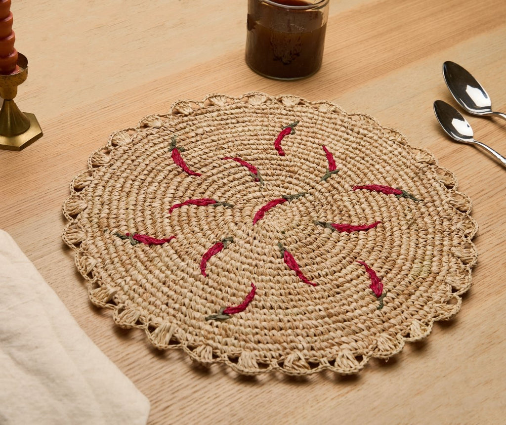 Scattered Chili Handwoven Raffia Round Placemat – Artisan Table Décor - Liza Pruitt